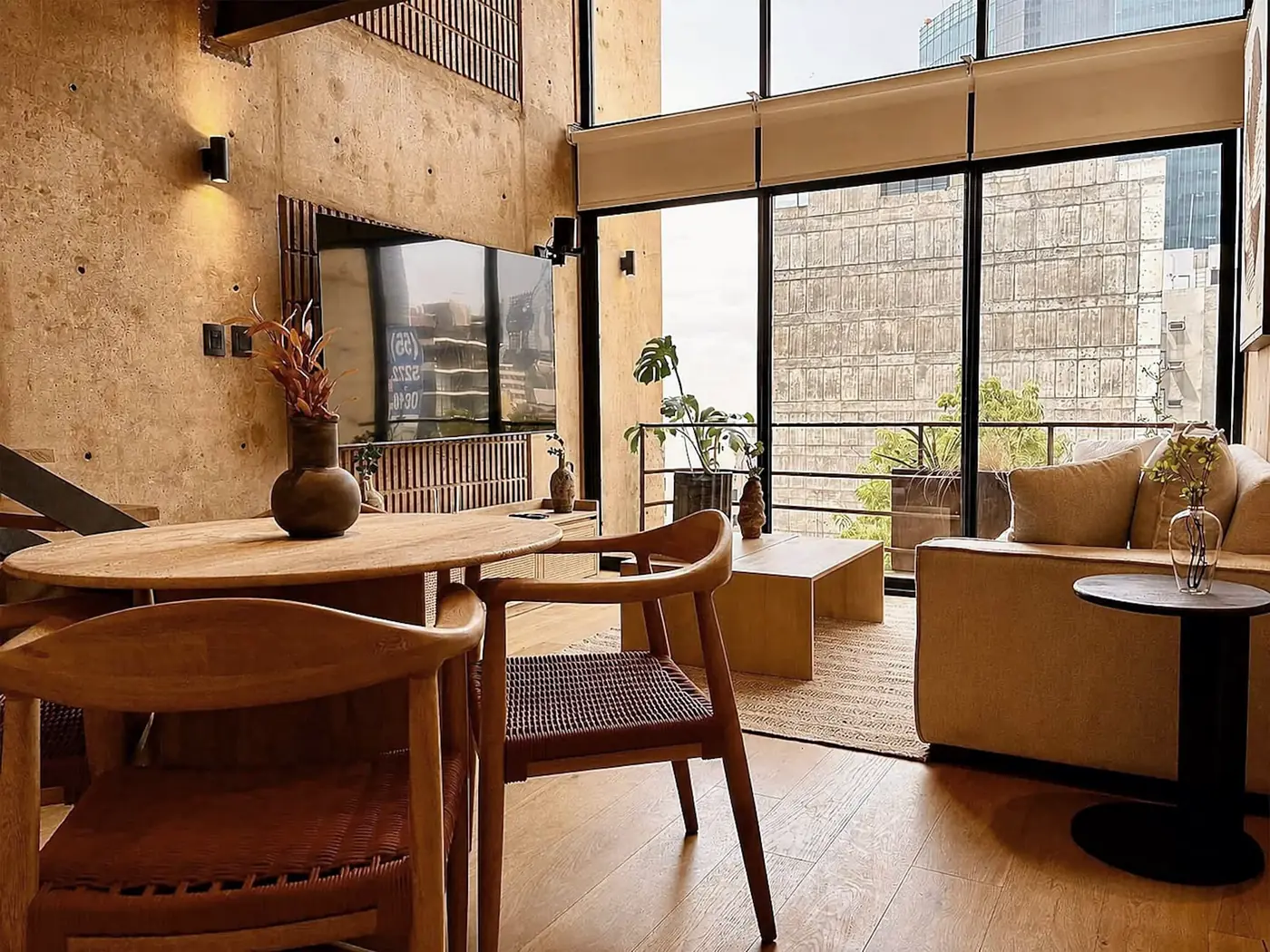 KIN, Dining beneath the double-height window